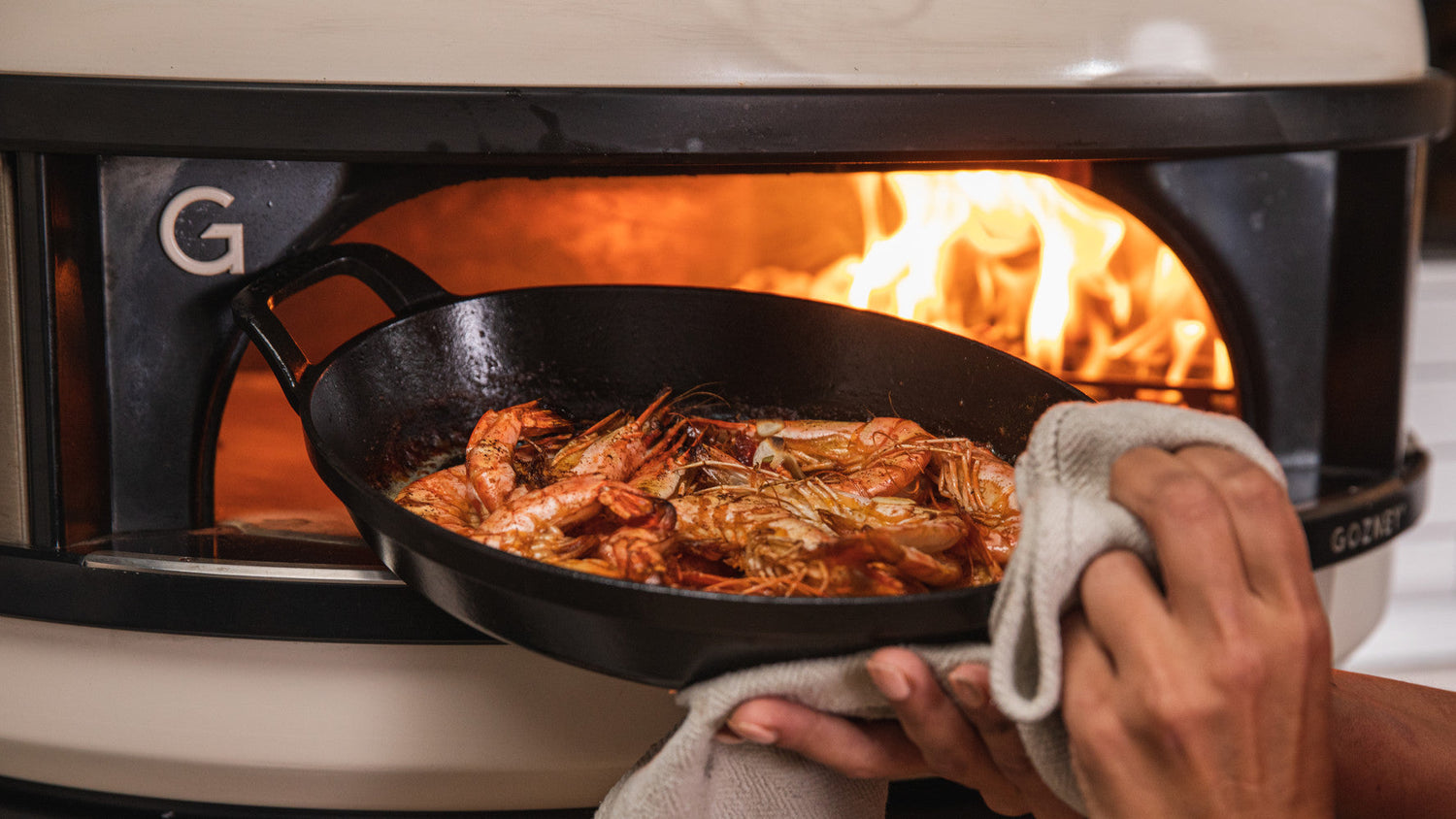 Prawns in cast iron pan pulled from Gozney Pizza Oven