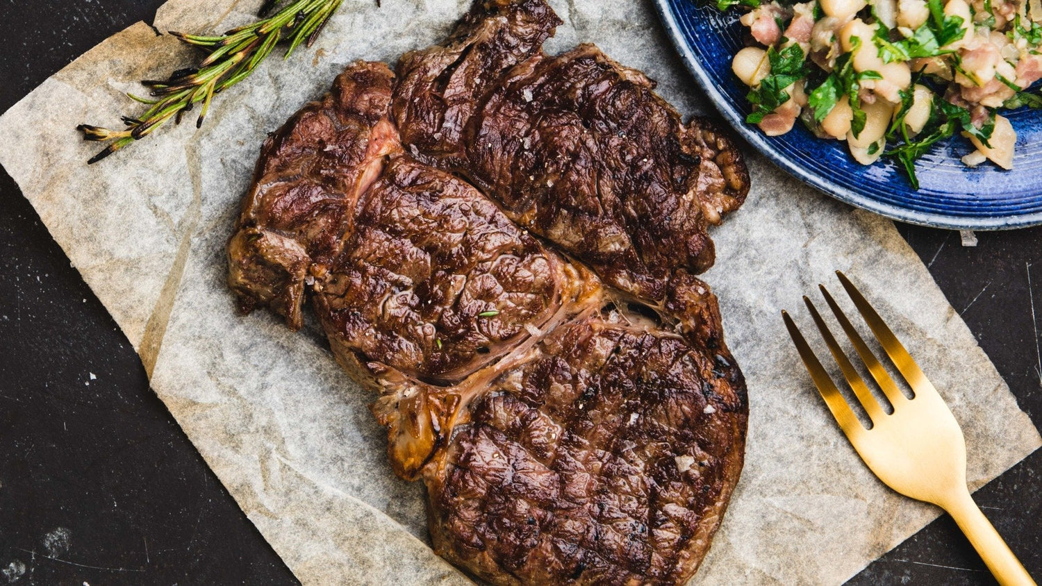 Rib Eye Steak with Bacon & Cannellini Beans with Gremolata - Gozney recipe poster image