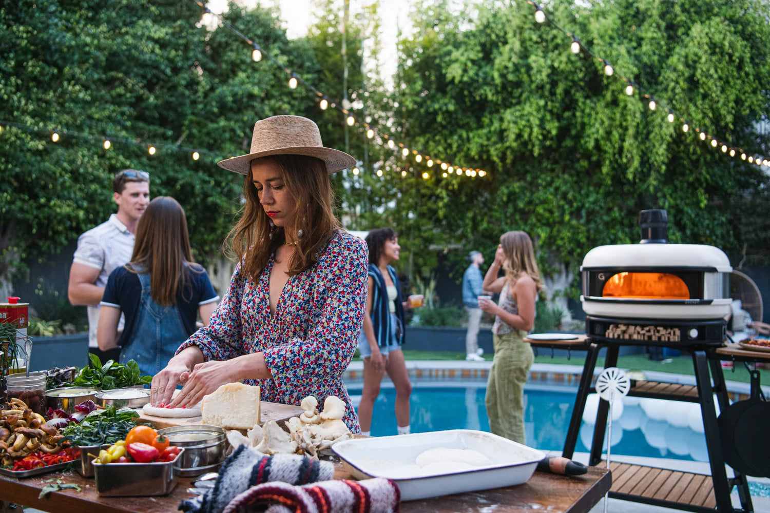 outdoor kitchen with a pizza oven recipe poster image